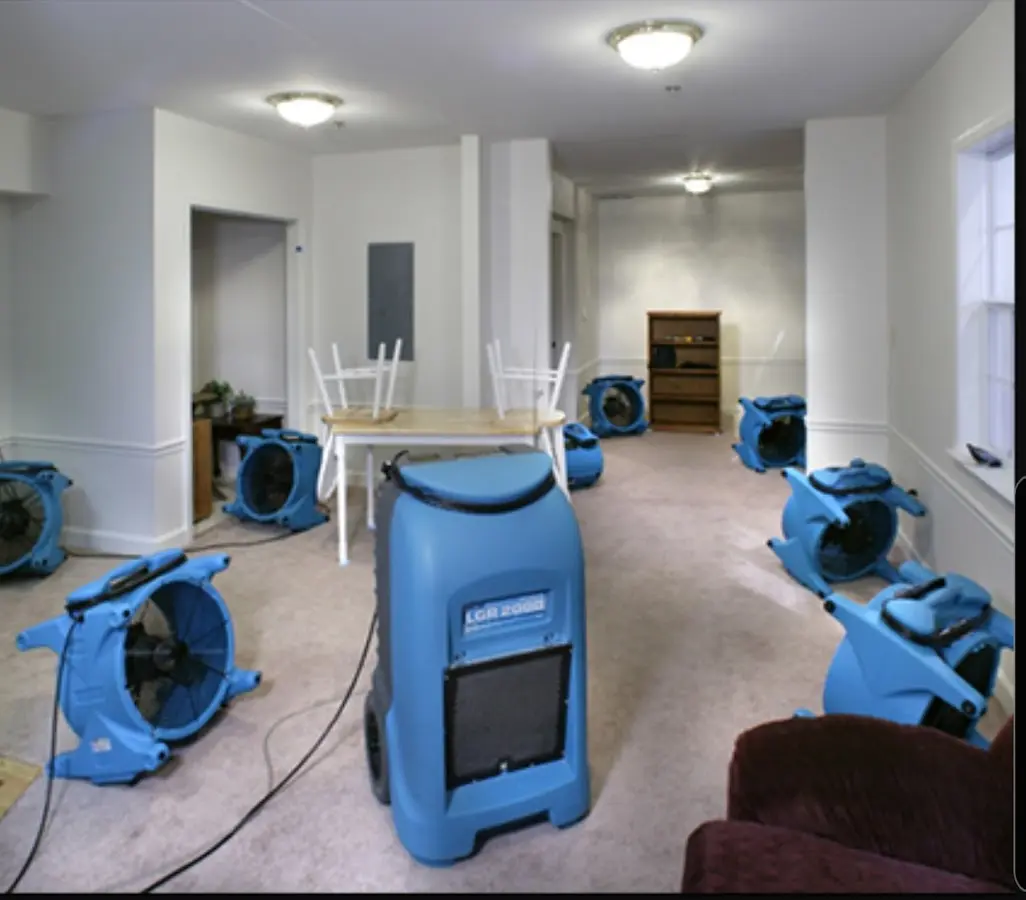 Air movers and dehumidifier setup for Water Damage Restoration in Laurens